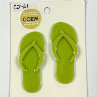 Pair of bright green flip-flops attached to a white display card, front view